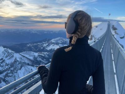 Emma Laird is standing in the bridge watching the mountains.